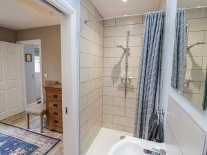 a bathroom with a shower and a sink at Rose Stables in Carterton +19 photos