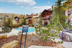 a resort with a swimming pool in front of a building at Eagle Springs East 304: Josephine's Suite in Solitude