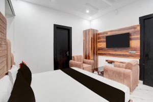 Postel nebo postele na pokoji v ubytování Hotel O G+