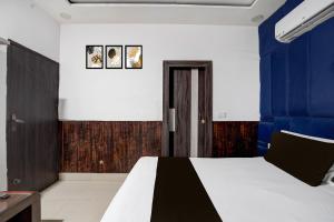 Postel nebo postele na pokoji v ubytování Hotel O G+