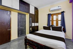 Voodi või voodid majutusasutuse Hotel O HAPPY HOMESTAY toas +21 fotot