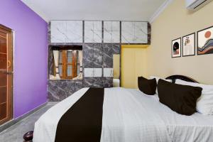 Voodi või voodid majutusasutuse Hotel O HAPPY HOMESTAY toas