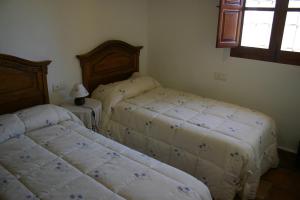 Postel nebo postele na pokoji v ubytování Alojamientos Rurales Cortijo Las Golondrinas