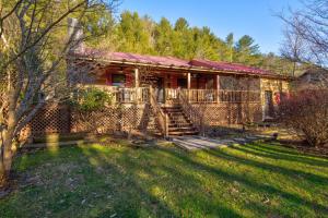 an old house with a yard in front of it at On The River in Banner Elk