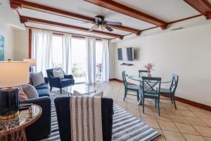 a living room with a couch and a table at The Vue 233 in Tybee Island