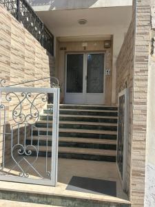 a front door of a house with a gate at Spacious Apartment Casablanca in Casablanca