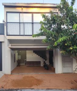 a view of a house with a balcony at Private Suíte Zitinhus 1 a 5 pessoas in Andradina