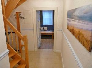 a hallway with a staircase leading to a bathroom at Haus Wellenkamp in Burg auf Fehmarn