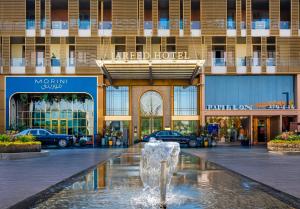 a fountain in the middle of a shopping mall at Jareed Hotel Riyadh in Riyadh
