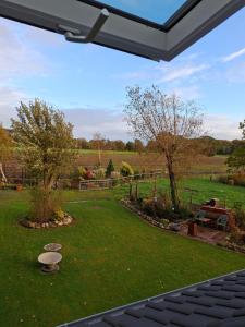 a view of a garden from a patio at Hof Nordholz in Großenkneten