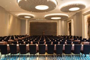 a conference room with chairs and a projection screen at Centara Life Maris Resort Jomtien in Jomtien Beach +95 photos