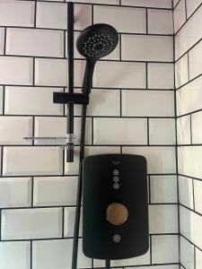 a phone hanging on a wall in a bathroom at The Loft in Clonmore +15 photos