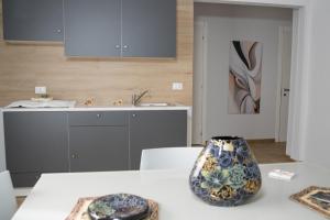 a kitchen with a table with a vase on it at B&B fly in Reggio di Calabria