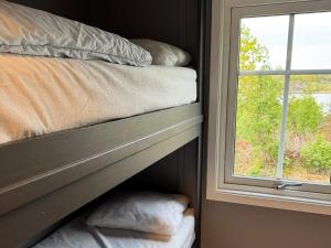 Ένα ή περισσότερα κρεβάτια σε δωμάτιο στο 5 star holiday home in Mastrand