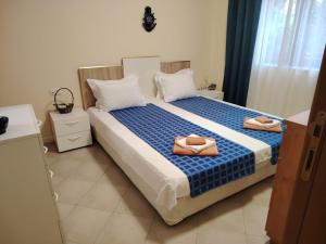 Postel nebo postele na pokoji v ubytování Санта Марина-Сладка къща + 27 fotografií