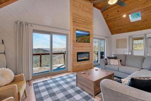 a living room with a couch and a table at Calling Me Home in Blowing Rock