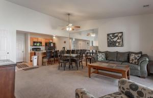 a living room with a couch and a table at Table Rock Lakeview Condo - Sanctuary 446 in Radical