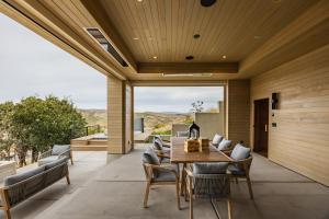 a dining room with a table and chairs at Stunning Luxury Interiors, Jordanelle Views, Private Hot Tub, Sauna, Elite Locale! in Francis