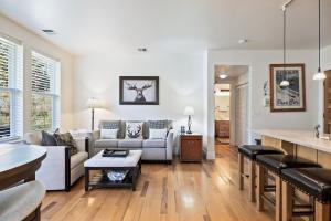 a living room with a couch and a table at Summit Sanctuary, Sleeps 4, Charming Interiors, 20 Minutes from the Mountain! in Gorgosa