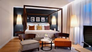 a bedroom with a bed with a large mirror at B&B HOTEL RZESZÓW CENTRUM in Rzeszów +45 photos