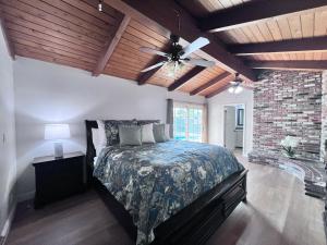 a bedroom with a bed and a ceiling fan at Destination #13 in Anaheim