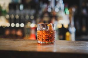 a glass of iced tea sitting on a bar at Siglo Hotel by Keahotels in Siglufjörður