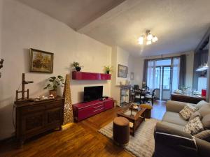 a living room with a couch and a fireplace at Villa Seven 2 in Dunkerque