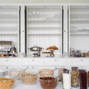 a kitchen with many bowls of food on a counter at Siglo Hotel by Keahotels in Siglufjörður