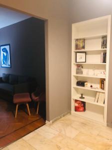a living room with a couch and a chair at Casa D Azeglio in Turin