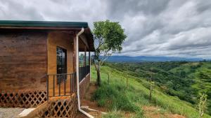 a house on a hill with a view at Dulces Momentos PZ 