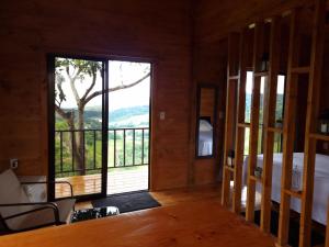 a room with a bed and a large glass door at Dulces Momentos PZ 