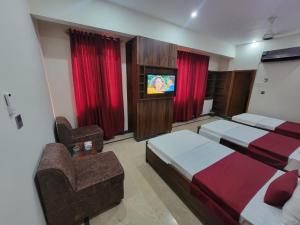 Μια τηλεόραση ή/και κέντρο ψυχαγωγίας στο Airport Guest House - JIA