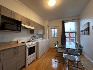 a kitchen with a stove and a table and chairs at FULL KITCHEN 10min from DTOWN Room B in Montréal