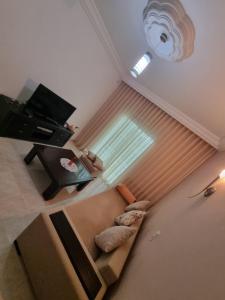 a living room with a couch and a window at Ferienwohnung Nabeul in Douane