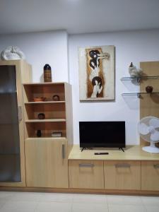 TV a/nebo společenská místnost v ubytování Maradentro