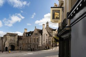 a building with a sign on the side of a street at The Westgate in Winchester