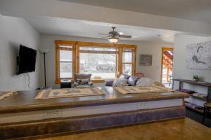 a living room with a couch and a table at The Loose Moose Lodge #4 At Downtown Grand Lake in Grand Lake