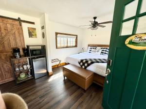 a bedroom with a bed and a ceiling fan at The Loose Moose Cabin #10 At Downtown Grand Lake in Grand Lake