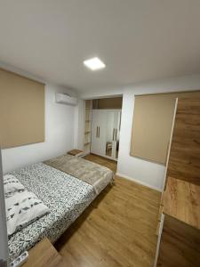 Ένα ή περισσότερα κρεβάτια σε δωμάτιο στο Tara Apartments +3 φωτογραφίες