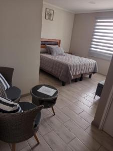 Ένα ή περισσότερα κρεβάτια σε δωμάτιο στο Hostal Terraza Traslaviña