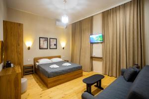 Ένα ή περισσότερα κρεβάτια σε δωμάτιο στο Edmar Boutique Stay