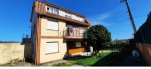 a house with a balcony on the side of it at Christmas lights accommodation Vigo in Redondela