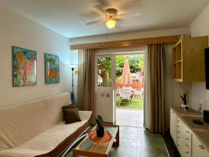 a living room with a couch and a table at Oasis Lemon in Maspalomas