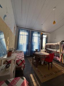 a room with a bed and a table and chairs at Hostel Torre Bahia in Salvador +266 photos