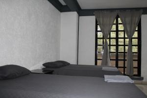 Ένα ή περισσότερα κρεβάτια σε δωμάτιο στο Hotel Boutique Camino Viejo