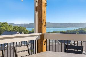 a balcony with chairs and a view of the water at Ingallview at Branson Cove Indoor Pool in Hollister