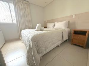 Postel nebo postele na pokoji v ubytování iFlat Brookfield Towers 2/4 Jardim Goiás