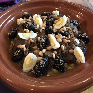 a plate of food with beans and eggs on it at Gite d'tape handour in Hamdour