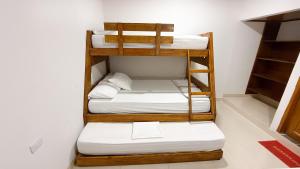 Ένα ή περισσότερα κρεβάτια σε δωμάτιο στο Cabaña Datalu 3