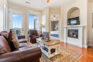 a living room with a couch and a fireplace at Sunset Retreat - 3 Min from Silver Dollar in Branson +29 photos